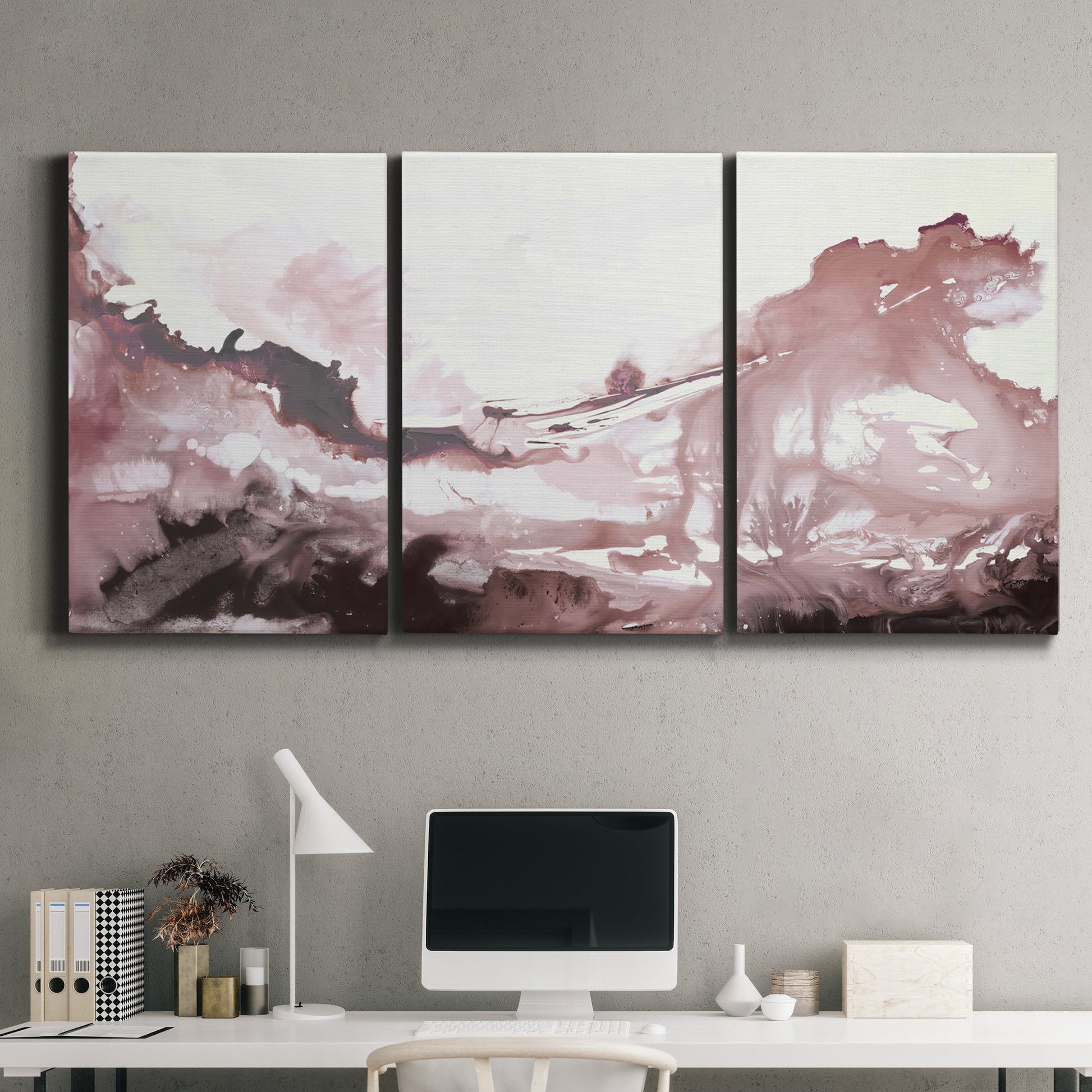 Three-panel canvas wall art featuring soft pink abstract scenic layers, displayed above a desk in a home office.