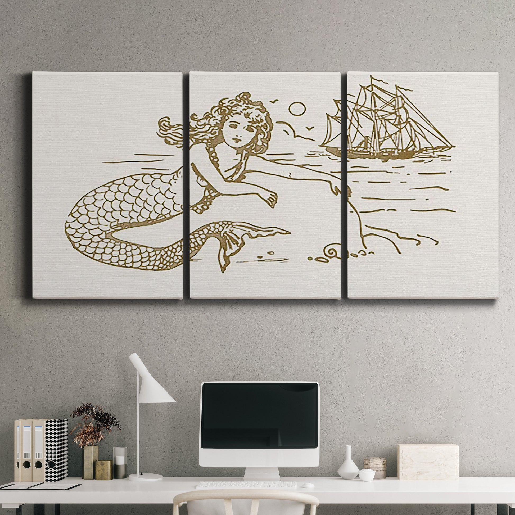 Three-panel canvas wall art featuring whimsical mermaid resting by sea, displayed above a desk in a home office.