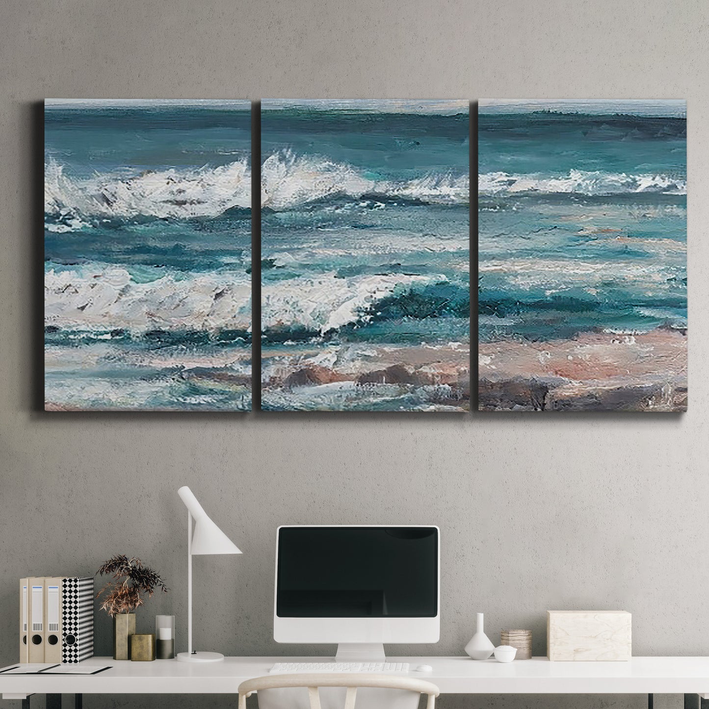 Three-panel canvas wall art featuring crashing ocean waves along shoreline, displayed above a desk in a home office.