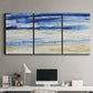 Three-panel canvas wall art featuring turbulent abstract ocean wave motion, displayed above a desk in a home office.