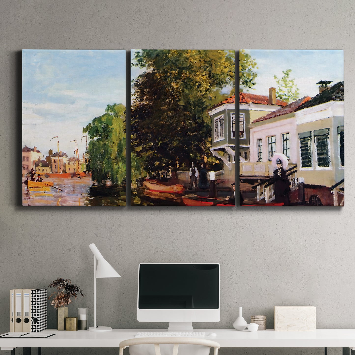 Three-panel canvas wall art featuring riverside houses along canal, displayed above a desk in a home office.