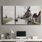 Three-panel canvas wall art featuring windmills beside calm water, displayed above a desk in a home office.
