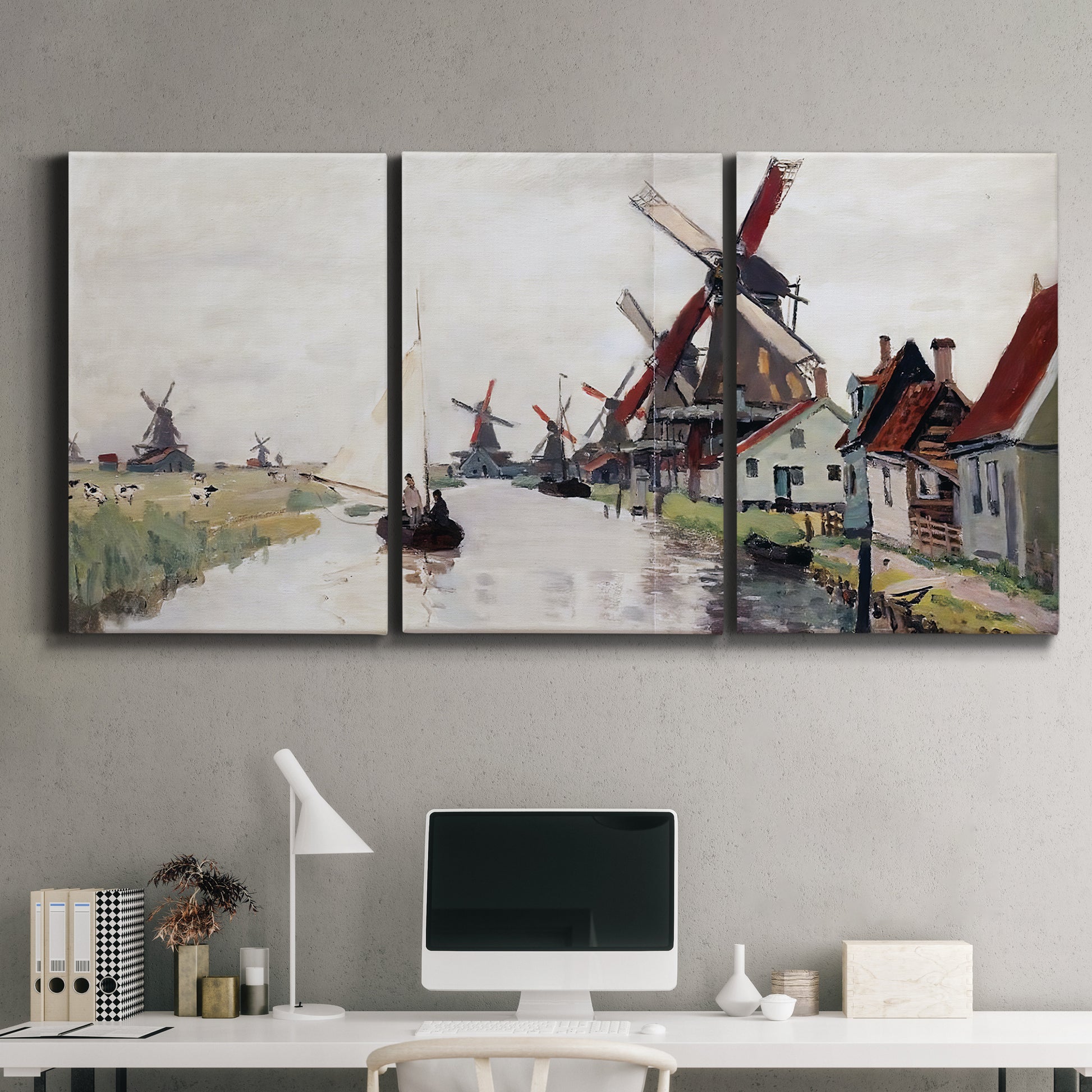 Three-panel canvas wall art featuring windmills beside calm water, displayed above a desk in a home office.