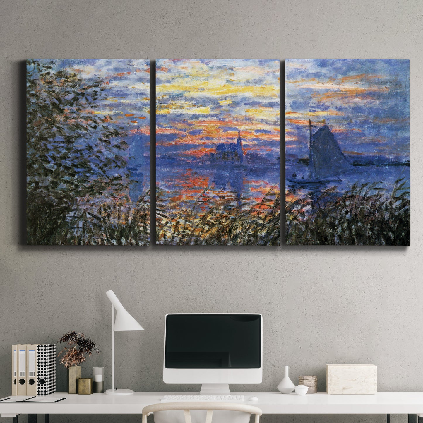 Three-panel canvas wall art featuring river sunset with reflections, displayed above a desk in a home office.