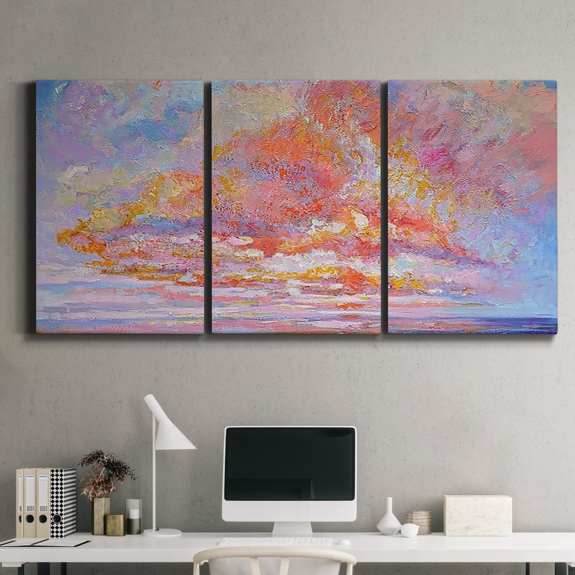 Three-panel canvas wall art featuring peaceful tropical inspired landscape, displayed above a desk in a home office.
