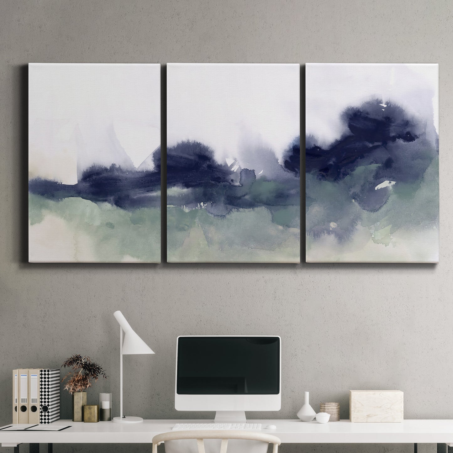 Three-panel canvas wall art featuring misty abstract lake watercolor, displayed above a desk in a home office.