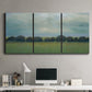 Three-panel canvas wall art featuring rolling green pastoral fields, displayed above a desk in a home office.
