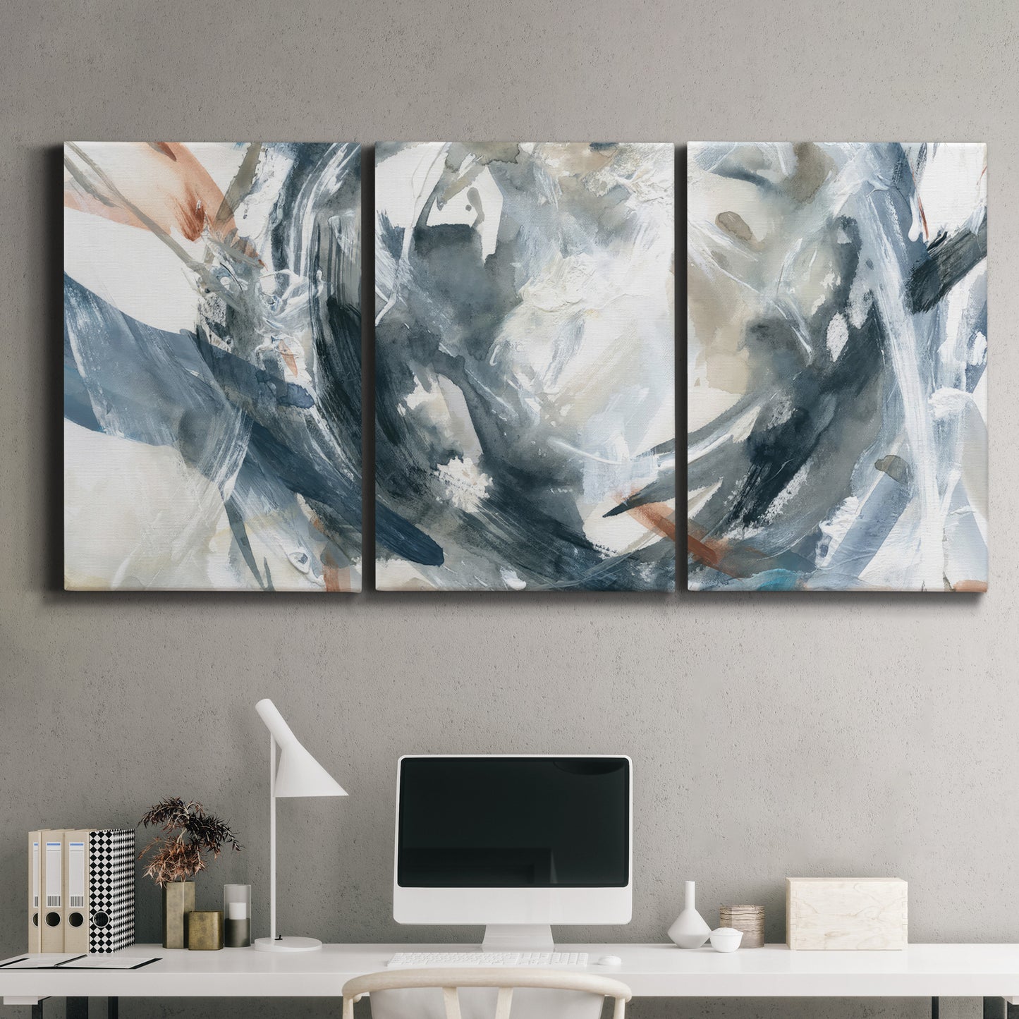 Three-panel canvas wall art featuring repeating abstract geometric array, displayed above a desk in a home office.