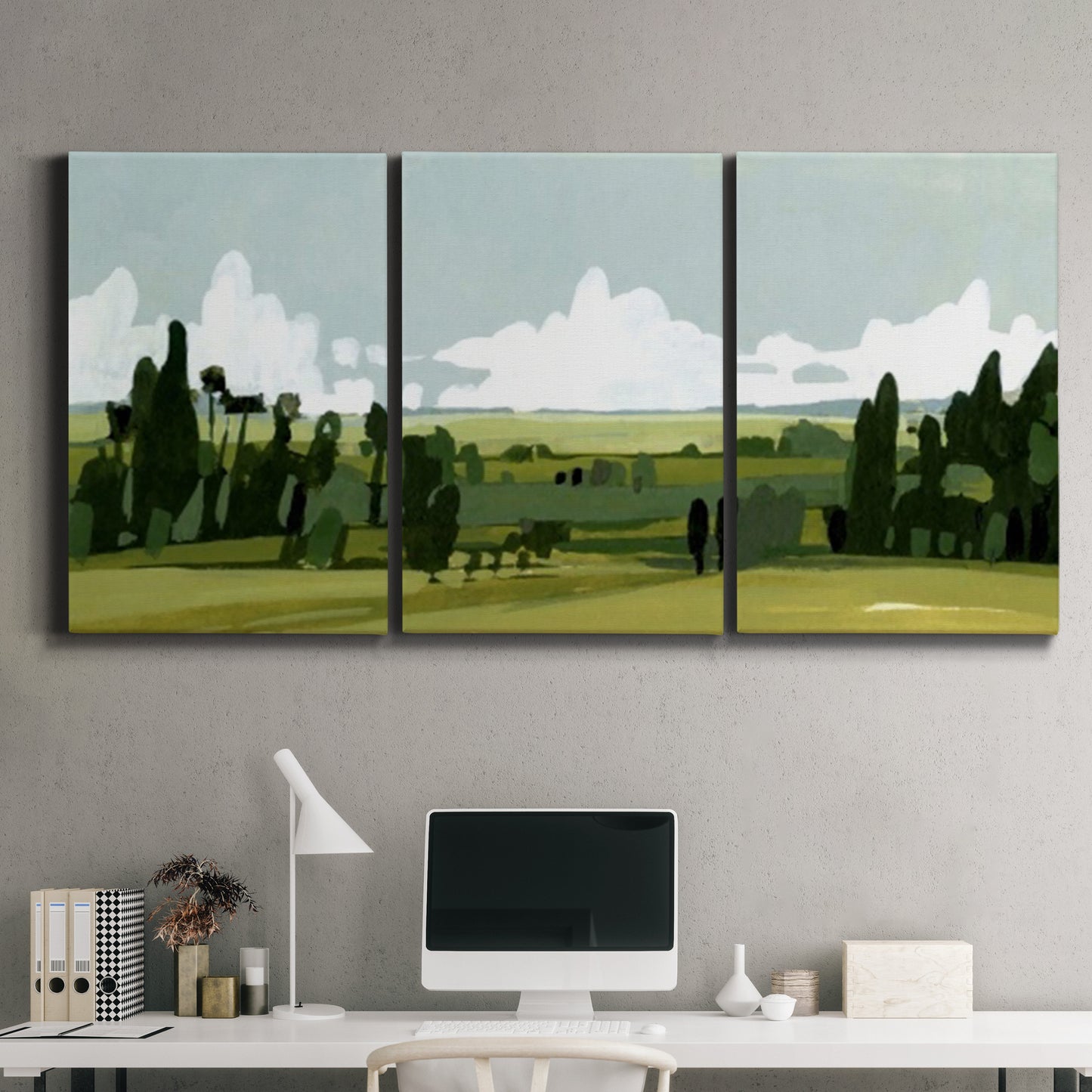 Three-panel canvas wall art featuring lush green summer countryside, displayed above a desk in a home office.