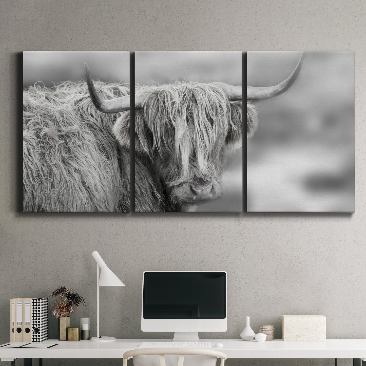 Three-panel canvas wall art featuring large highland cow portrait, displayed above a desk in a home office.