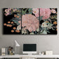 Three-panel canvas wall art featuring dark floral night blossoms, displayed above a desk in a home office.