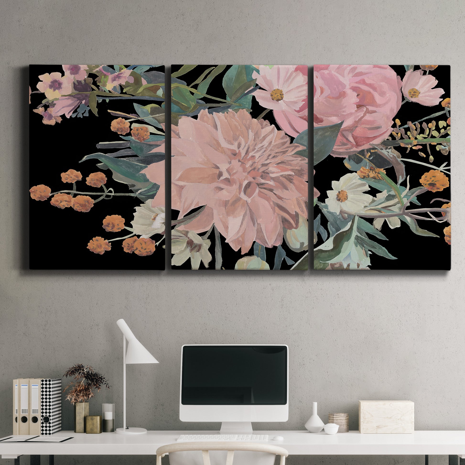 Three-panel canvas wall art featuring dark floral night blossoms, displayed above a desk in a home office.