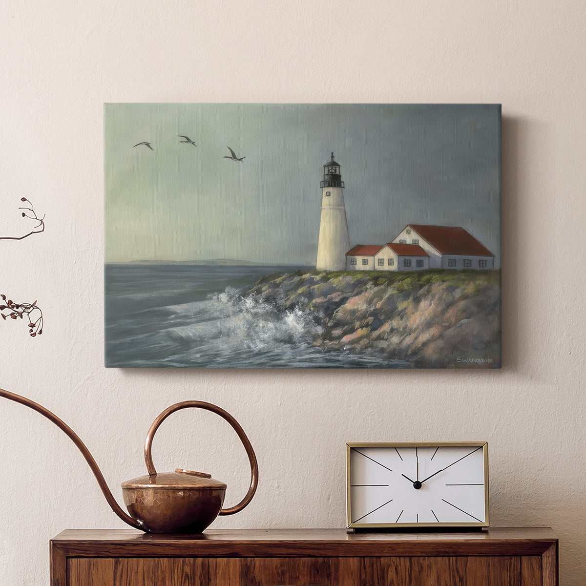 Lighthouse stands tall against crashing waves at a coastal location with birds flying overhead during a calm day