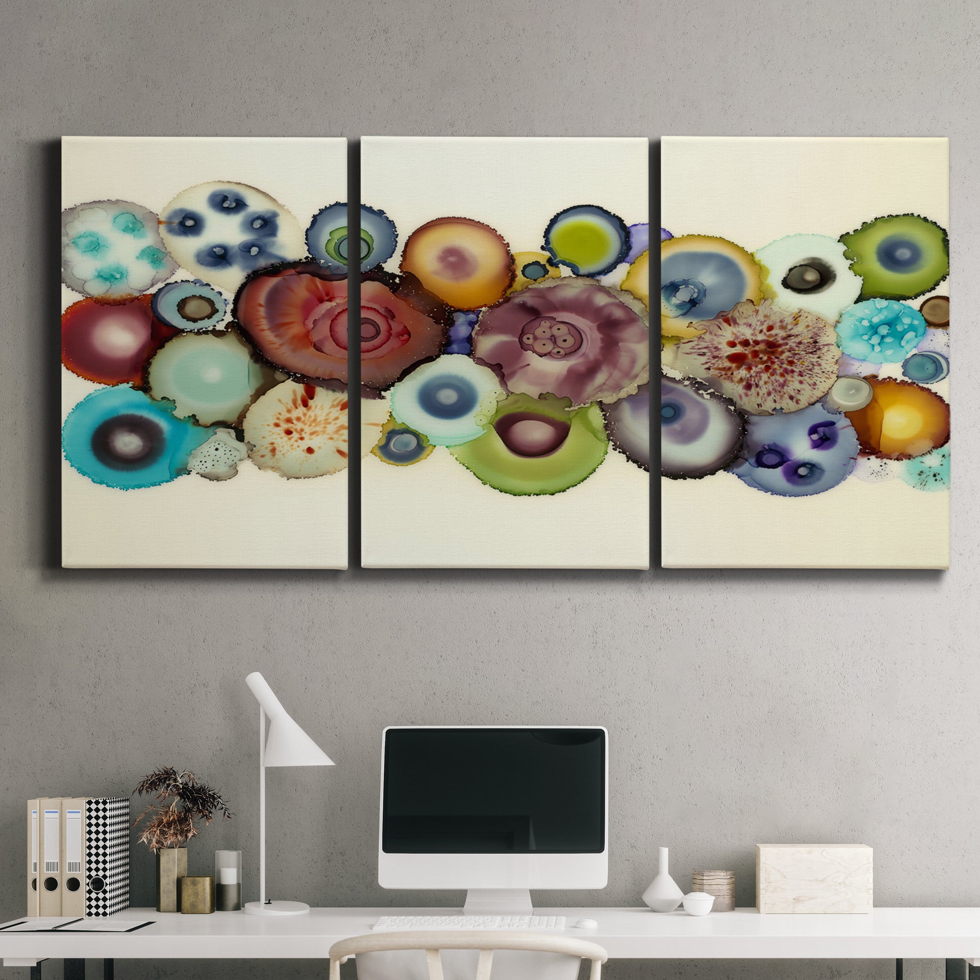 Three-panel canvas wall art featuring mid century geometric red pathway, displayed above a desk in a home office.