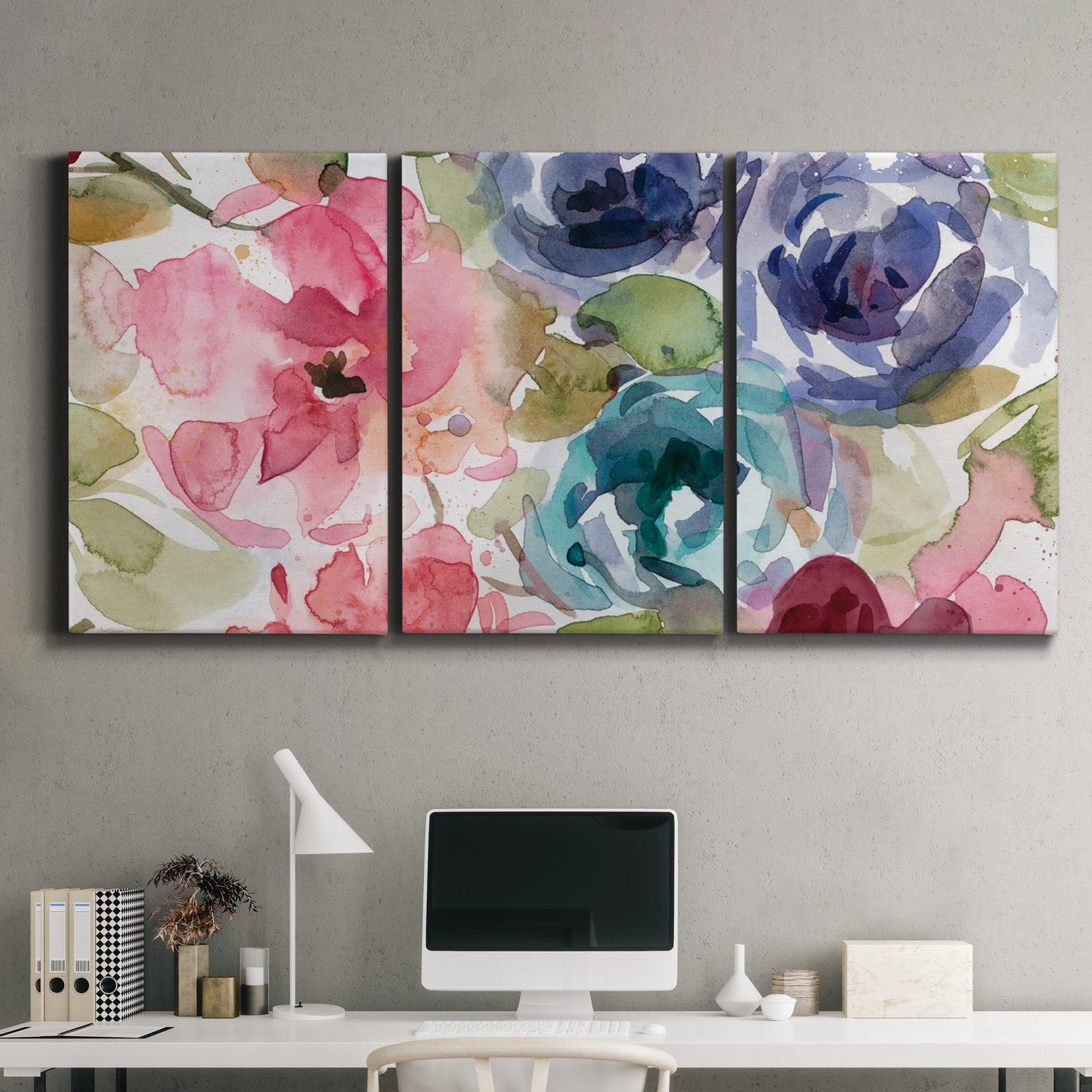 Three-panel canvas wall art featuring soft floral watercolor composition, displayed above a desk in a home office.