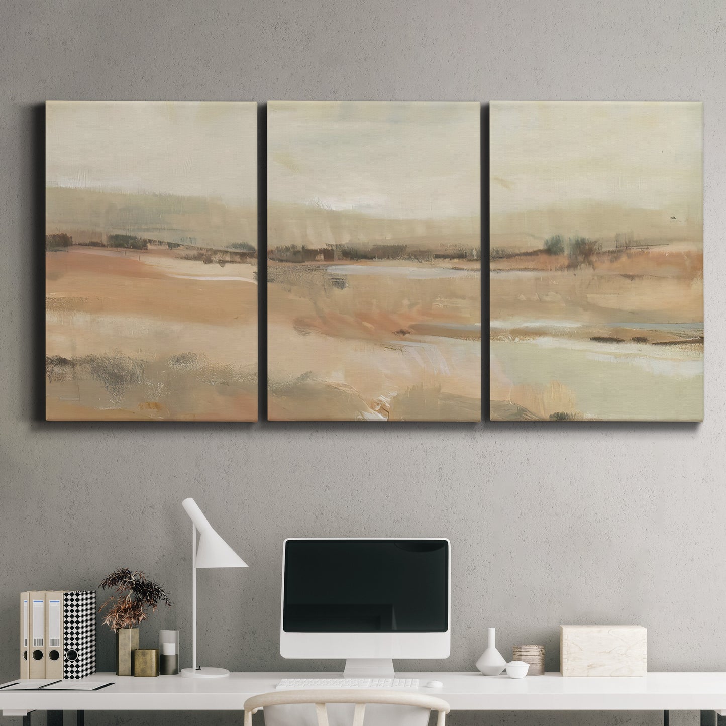 Three-panel canvas wall art featuring earth toned abstract landscape, displayed above a desk in a home office.