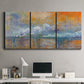 Three-panel canvas wall art featuring bridge shrouded in fog and smoke, displayed above a desk in a home office.