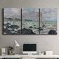 Three-panel canvas wall art featuring rough seas along rocky coast, displayed above a desk in a home office.