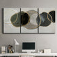 Three-panel canvas wall art featuring smooth abstract river stone forms, displayed above a desk in a home office.