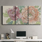 Three-panel canvas wall art featuring pastel peony flower composition, displayed above a desk in a home office.