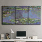 Three-panel canvas wall art featuring purple haze water lily pond, displayed above a desk in a home office.