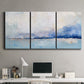 Three-panel canvas wall art featuring abstract bay with rhythmic forms, displayed above a desk in a home office.