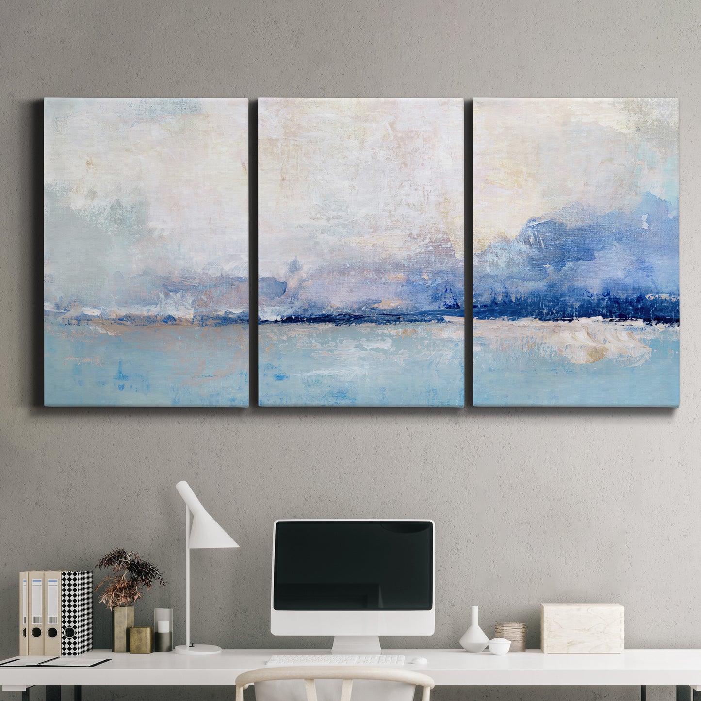 Three-panel canvas wall art featuring abstract bay with rhythmic forms, displayed above a desk in a home office.