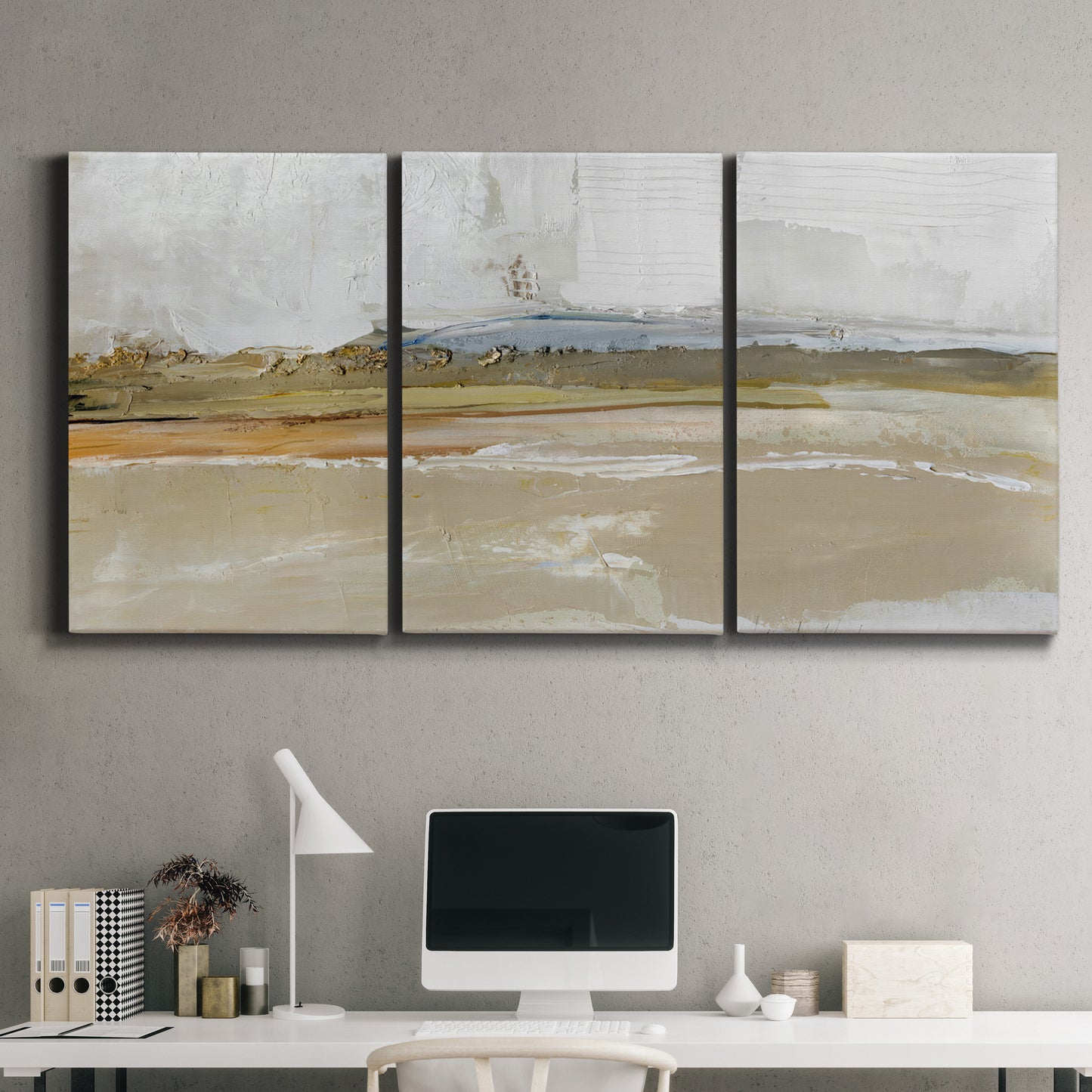 Three-panel canvas wall art featuring golden hour light over landscape, displayed above a desk in a home office.