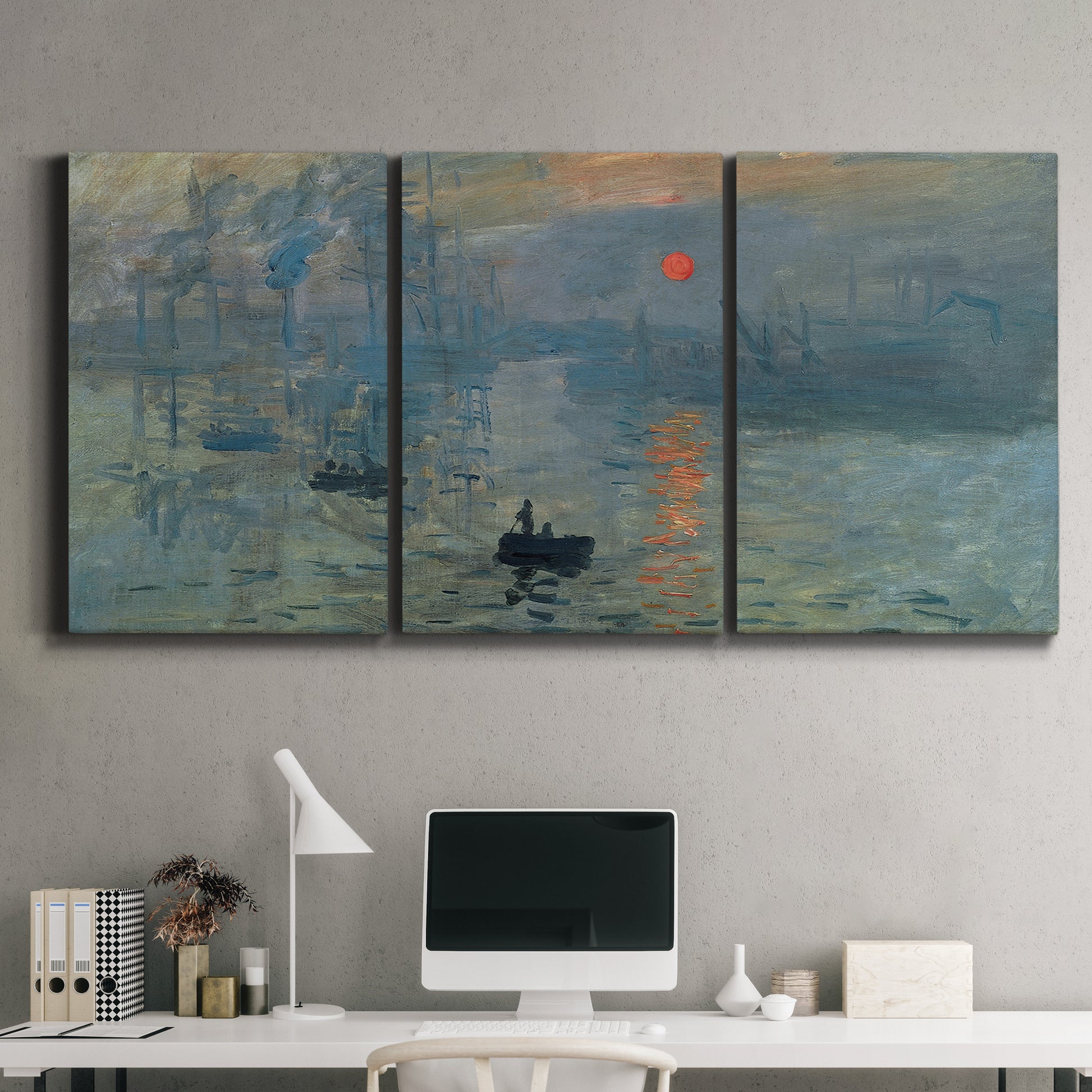 Three-panel canvas wall art featuring misty harbor sunrise with boats, displayed above a desk in a home office.
