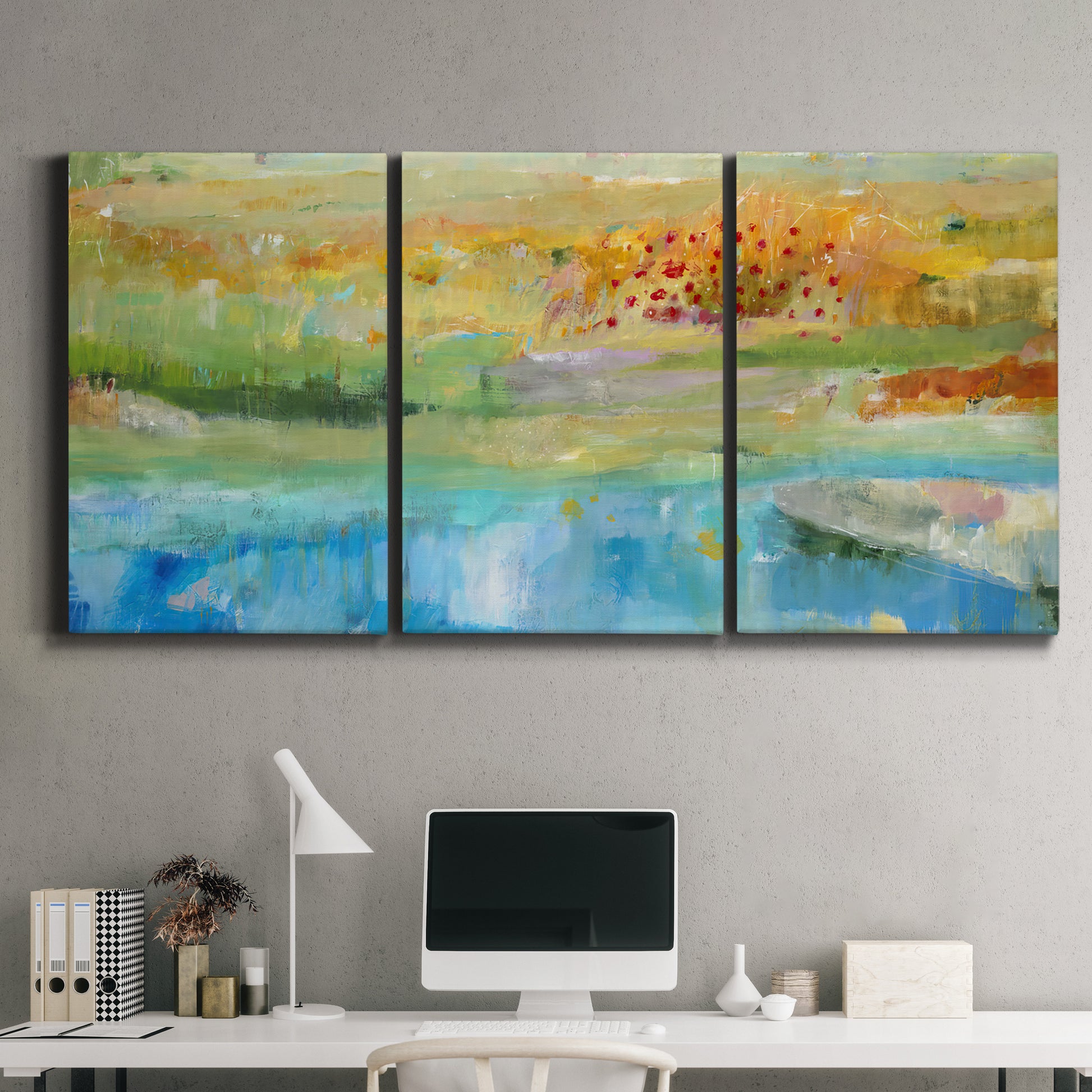Three-panel canvas wall art featuring abstract sense of forward movement, displayed above a desk in a home office.