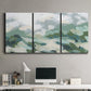 Three-panel canvas wall art featuring lush green hillside rolling landscape, displayed above a desk in a home office.