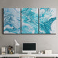 Three-panel canvas wall art featuring rocky coastal tide pool scene, displayed above a desk in a home office.