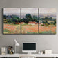 Three-panel canvas wall art featuring haystacks arranged in rural field, displayed above a desk in a home office.