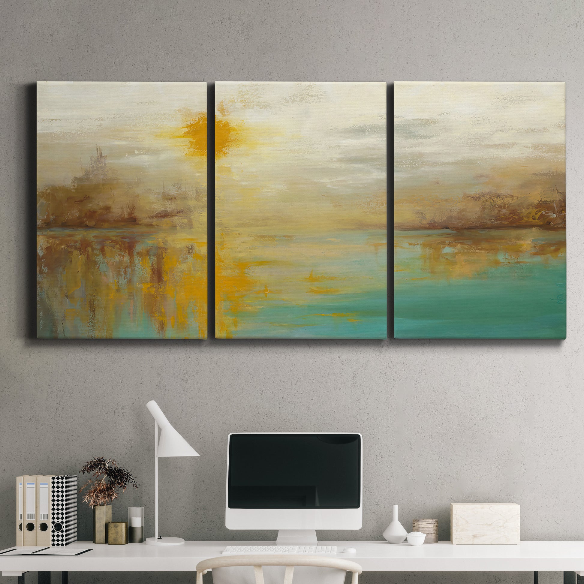 Three-panel canvas wall art featuring warm abstract end of summer palette, displayed above a desk in a home office.