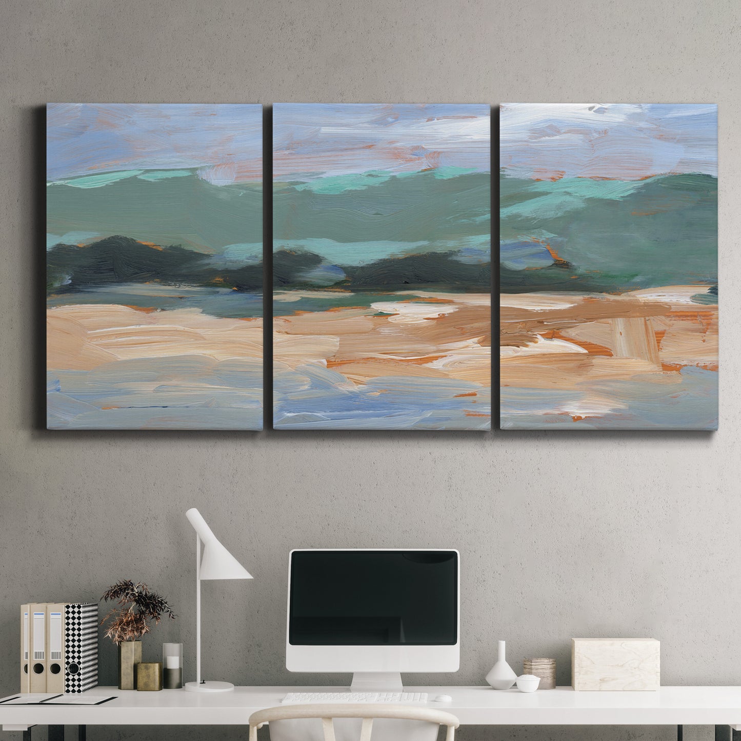 Three-panel canvas wall art featuring abstract landscape composition study, displayed above a desk in a home office.