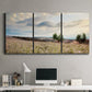 Three-panel canvas wall art featuring wildflowers across tuscan landscape, displayed above a desk in a home office.