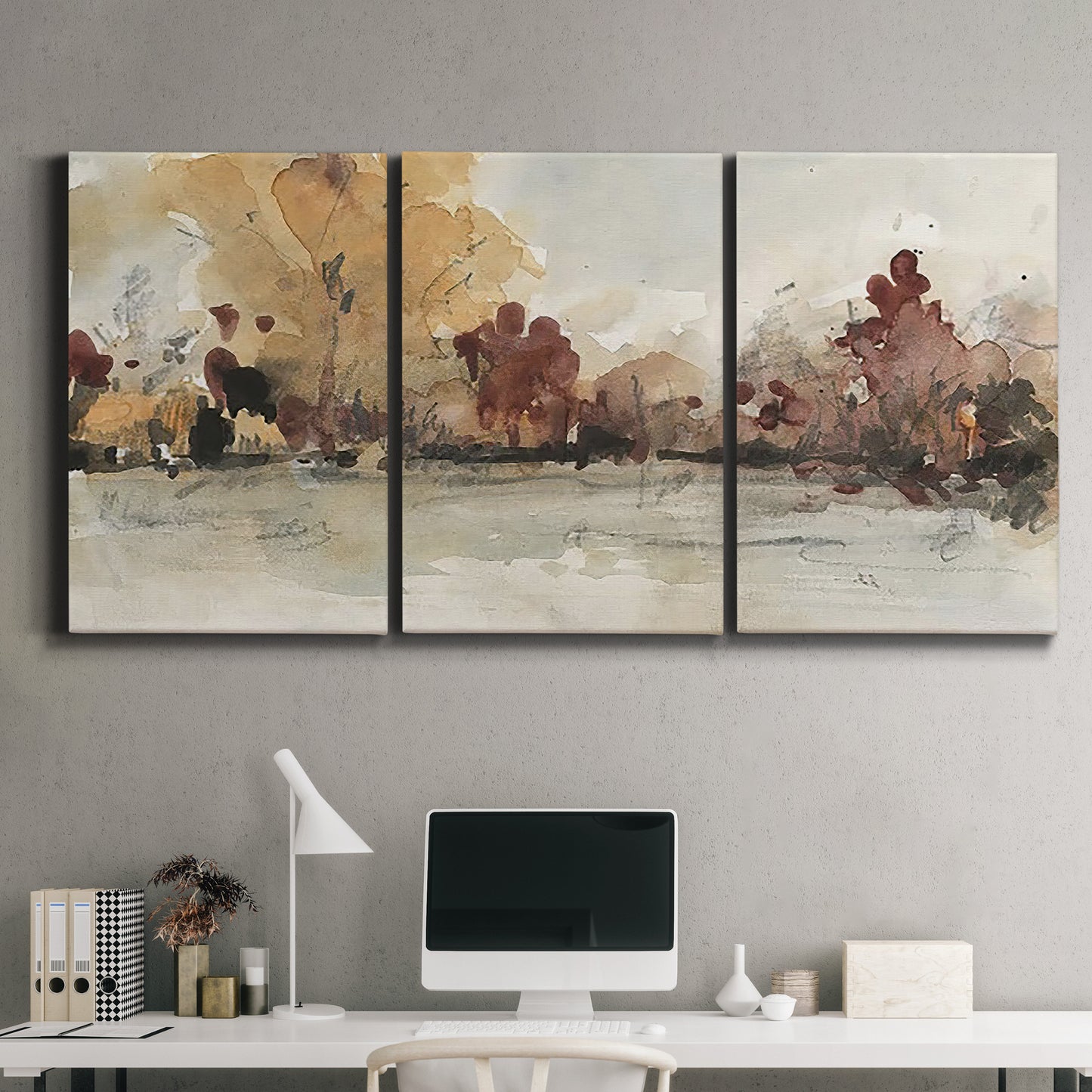 Three-panel canvas wall art featuring autumn landscape with trees and field, displayed above a desk in a home office.