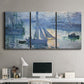 Three-panel canvas wall art featuring sailboats racing on river, displayed above a desk in a home office.