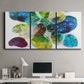 Three-panel canvas wall art featuring expressive abstract color interpretations, displayed above a desk in a home office.