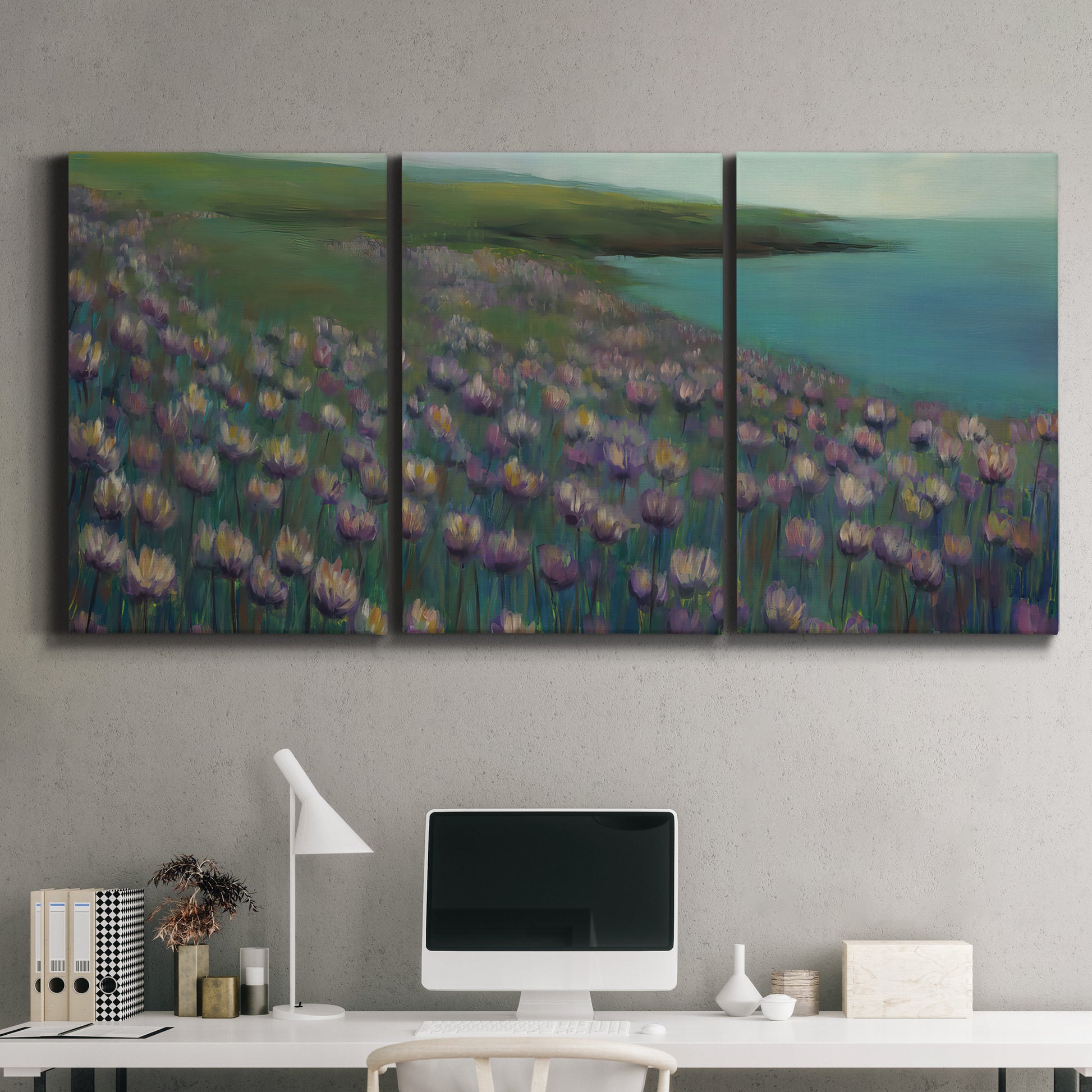 Three-panel canvas wall art featuring calm coastal landscape sanctuary, displayed above a desk in a home office.