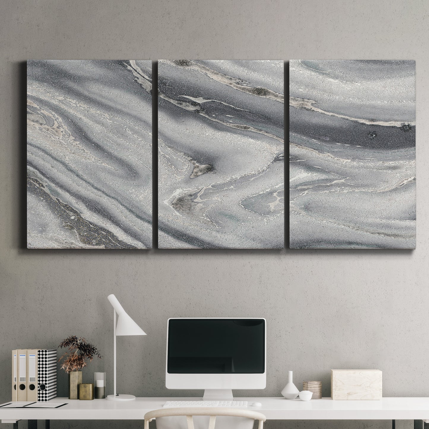 Three-panel canvas wall art featuring minimal monochrome abstract forms, displayed above a desk in a home office.