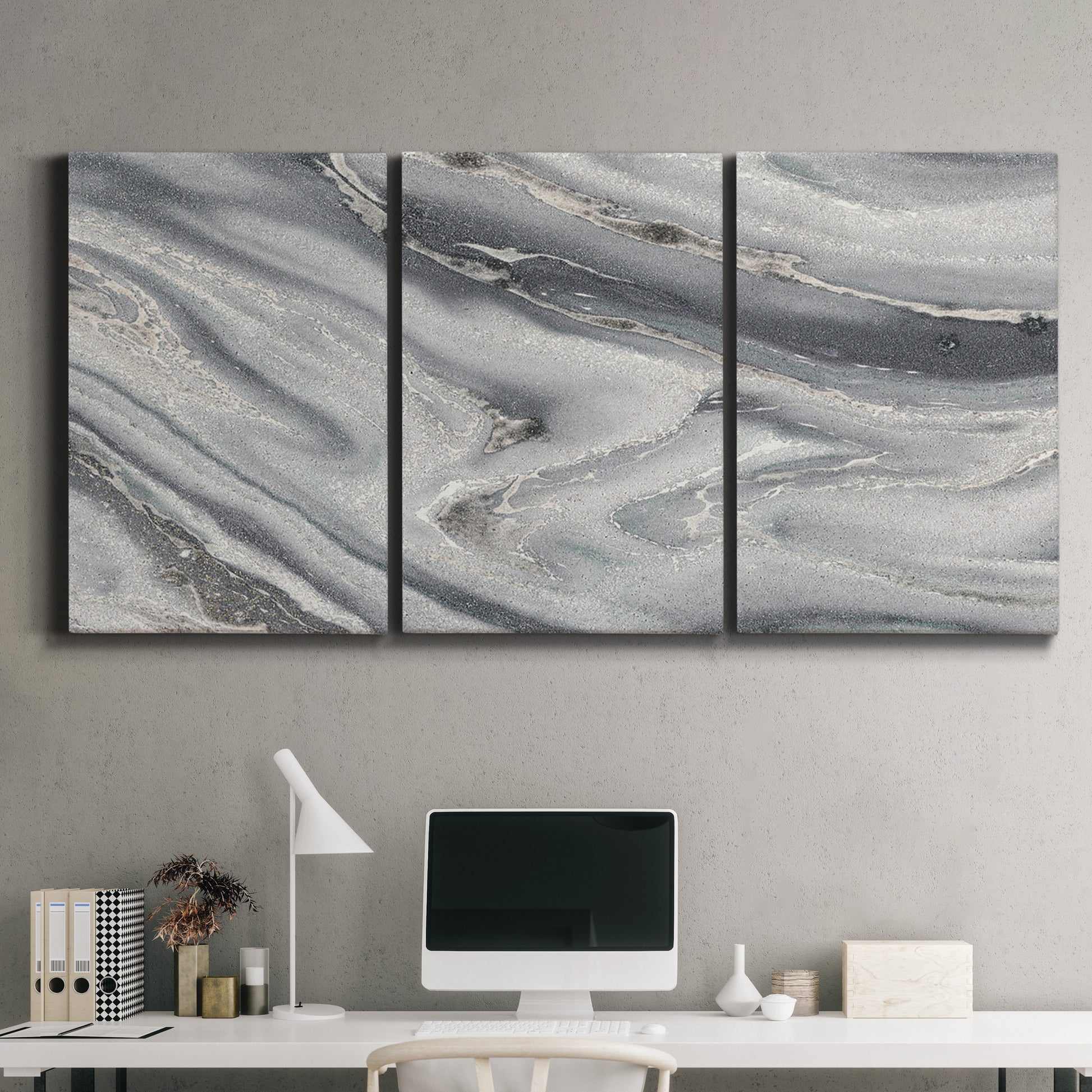 Three-panel canvas wall art featuring minimal monochrome abstract forms, displayed above a desk in a home office.