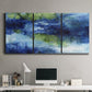 Three-panel canvas wall art featuring flowing blue abstract watercolor, displayed above a desk in a home office.