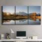 Three-panel canvas wall art featuring river canyon landscape photograph, displayed above a desk in a home office.