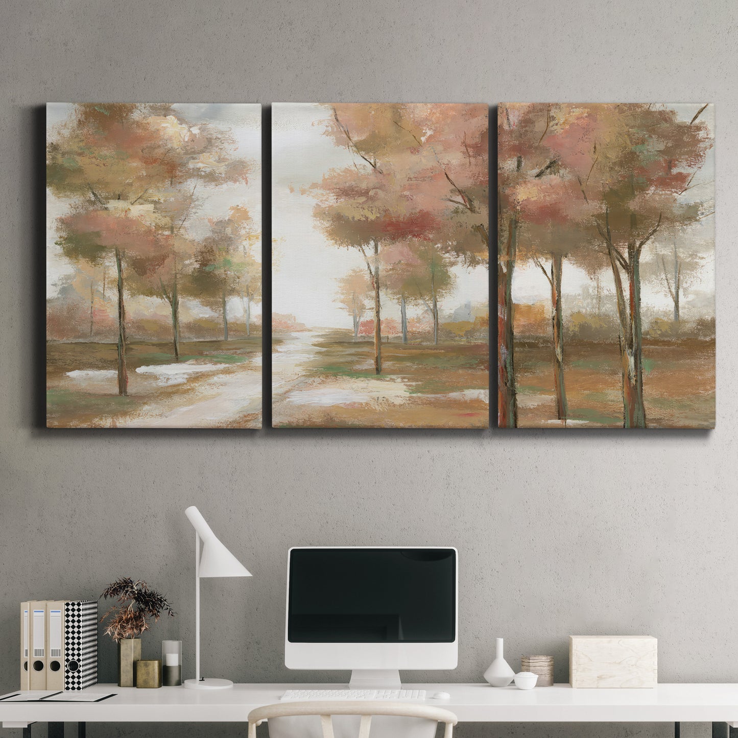 Three-panel canvas wall art featuring soft pastel park landscape scene, displayed above a desk in a home office.
