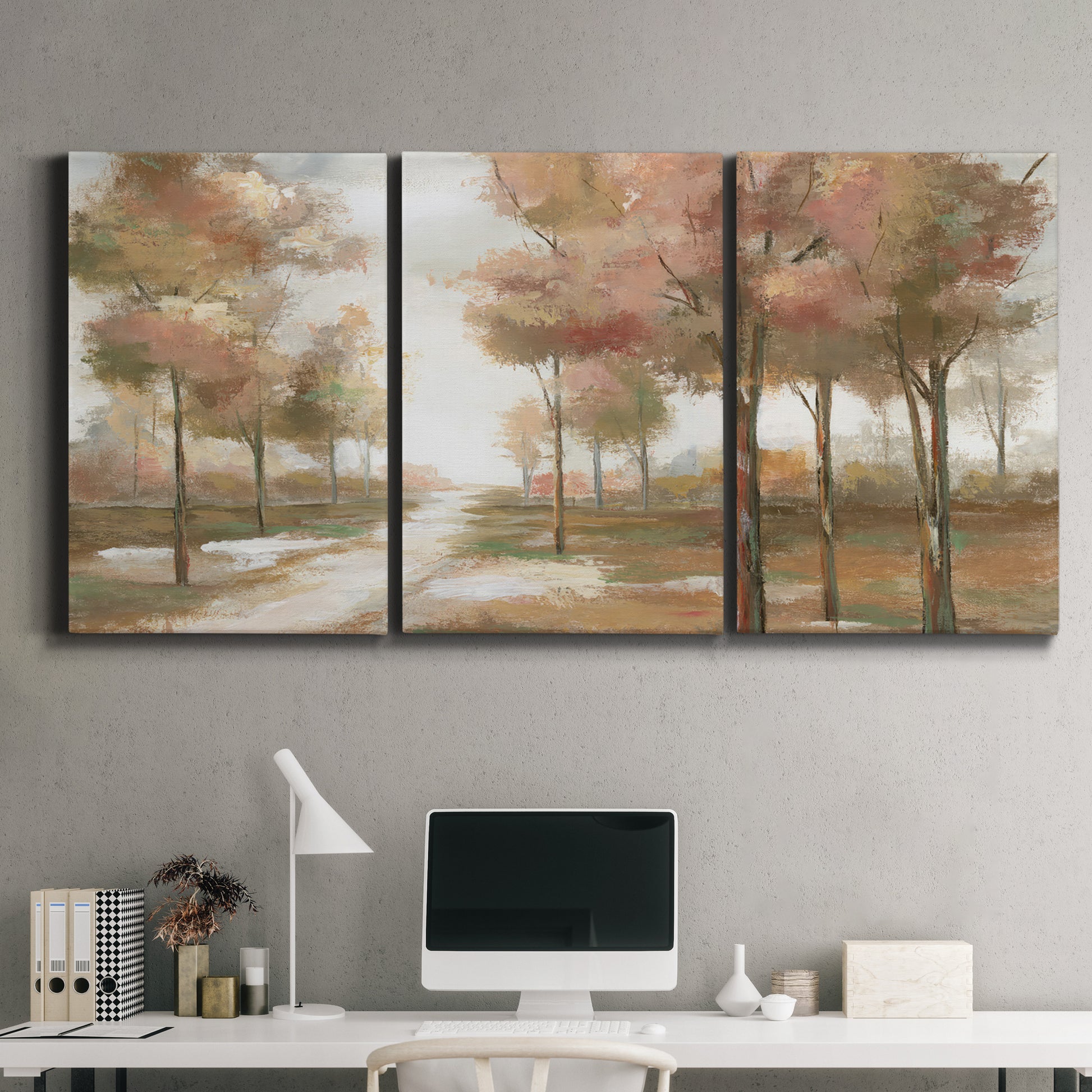 Three-panel canvas wall art featuring soft pastel park landscape scene, displayed above a desk in a home office.