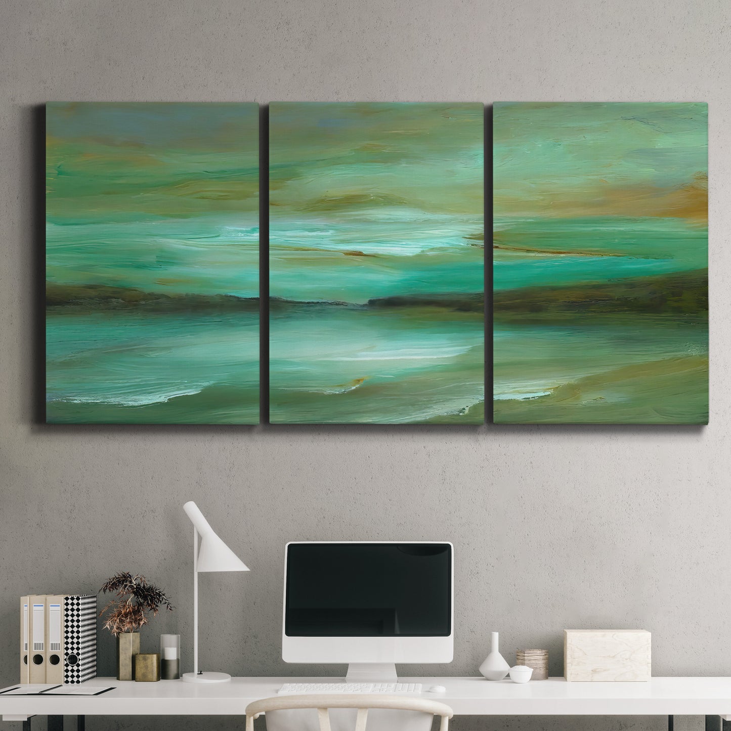 Three-panel canvas wall art featuring hidden coastal cove landscape, displayed above a desk in a home office.