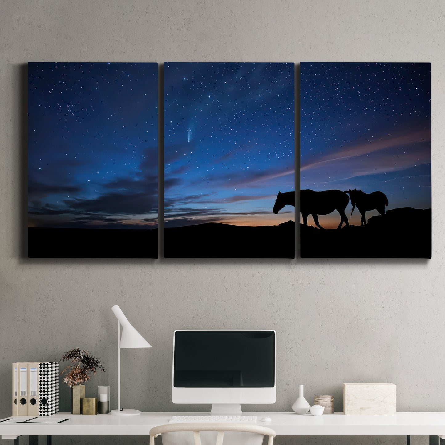 Three-panel canvas wall art featuring resting animals in open field, displayed above a desk in a home office.