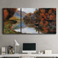 Three-panel canvas wall art featuring rowboat on quiet river bend, displayed above a desk in a home office.