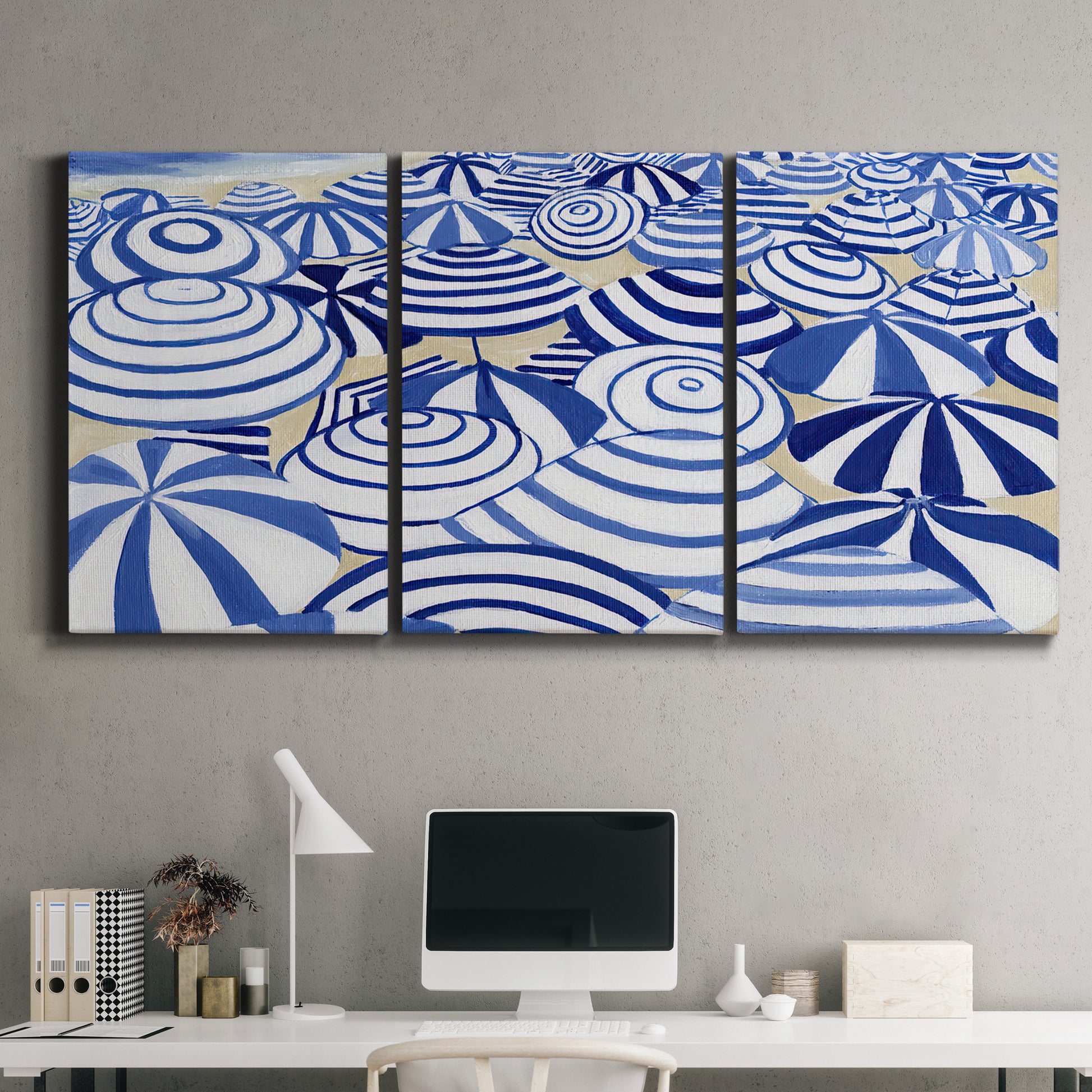 Three-panel canvas wall art featuring geometric abstract bowl forms, displayed above a desk in a home office.